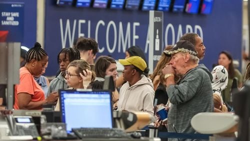 Passengers seek assistance at Delta ticket counters at Hartsfield-Jackson International Airport on Wednesday, July 24, 2024. (John Spink/The Atlanta Journal-Constitution/TNS)