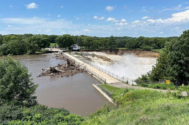 Heavy rains cause high water levels at the Rapidan Dam near Mankato, Minn., Monday, June 24, 2024. Officials say the dam is threatened with “imminent failure.” (AP Photo/Mark Vancleave)