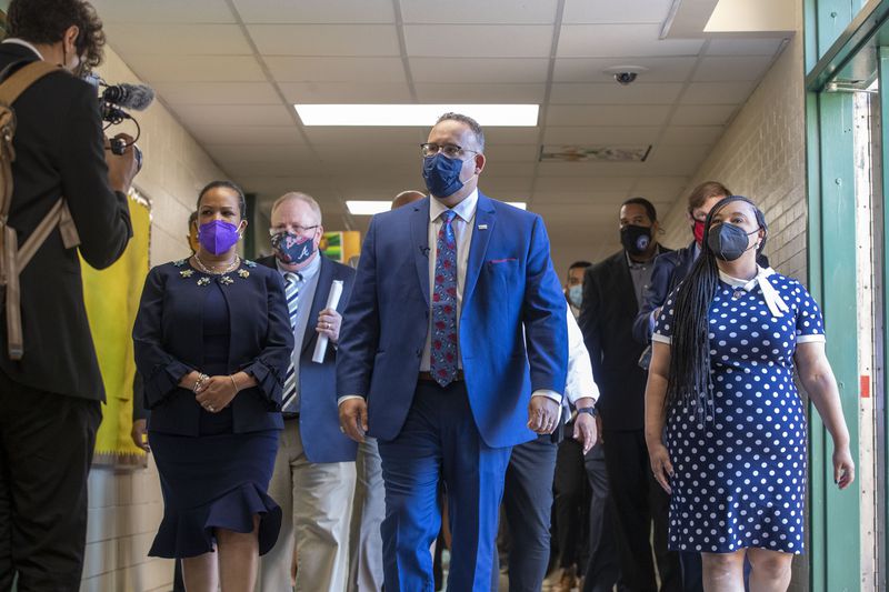 U.S. Secretary of Education Miguel Cardona, center, walks with U.S. Rep. Nikema Williams, right and DeKalb County School District Superintendent Cheryl Watson-Harris, left, during a tour of Kelley Lake Elementary School in Decatur on July 23, 2021. Watson-Harris was terminated from her position on April 26, 2022. (Alyssa Pointer/Atlanta Journal Constitution)
