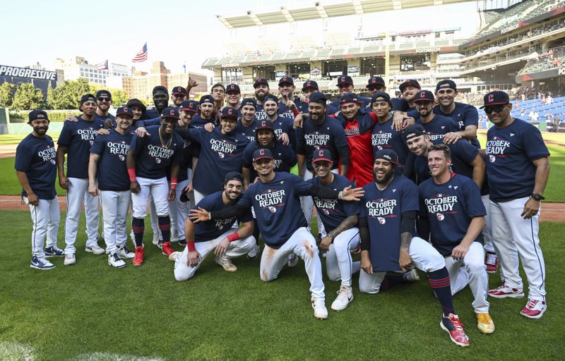 The Cleveland Guardians celebrate after their 10-inning win over the Minnesota Twins in a baseball game, Thursday, Sept. 19, 2024, in Cleveland. (AP Photo/Nick Cammett)