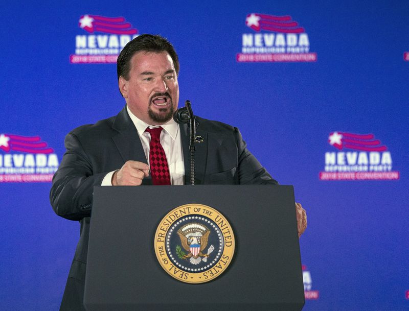 FILE - Nevada State GOP Chairman Michael McDonald announces President Donald Trump before he speaks at the Nevada Republican Party Convention, June 23, 2018, in Las Vegas. A Nevada state court judge dismissed a criminal indictment Friday, June 21, 2024, against six Republicans accused of submitting certificates to Congress falsely declaring Donald Trump the winner of the state’s 2020 presidential election. (AP Photo/L.E. Baskow, File)