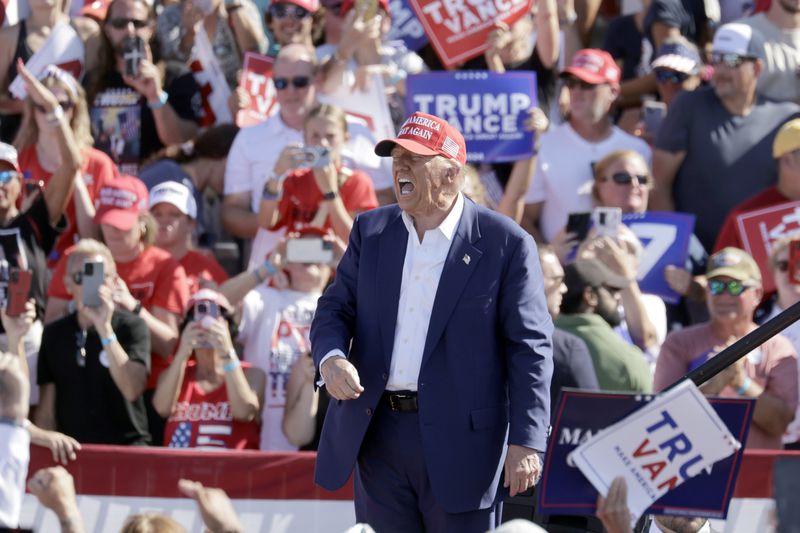 Republican presidential nominee former President Donald Trump shouts after speaking at a campaign event at Wilmington International Airport in Wilmington, N.C., Saturday, Sept. 21, 2024. (AP Photo/Chris Seward)