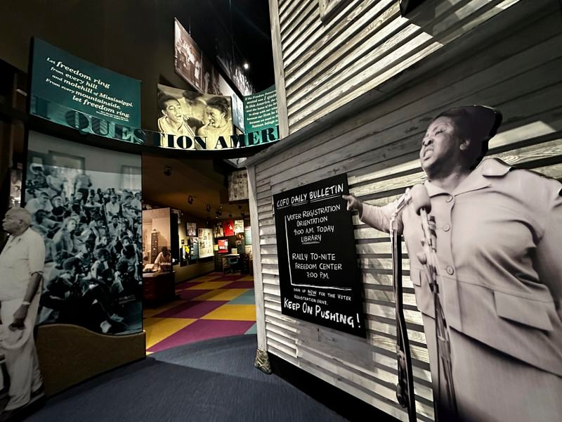 A life-size standee of Fannie Lou Hamer points to the "I Question America" is shown in an exhibit in the Mississippi Civil Rights Museum on Wednesday, Aug. 14, 2024, in Jackson, Miss. (AP Photo/Stephen Smith)