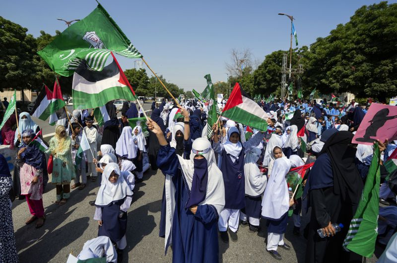 School children take part in a rally organized by Pakistan Markazi Muslim League party, to protest against Israeli airstrikes and to show solidarity with Palestinian people living in Gaza and Lebanon, in Karachi, Pakistan, Monday, Oct. 7, 2024. (AP Photo/Fareed Khan)