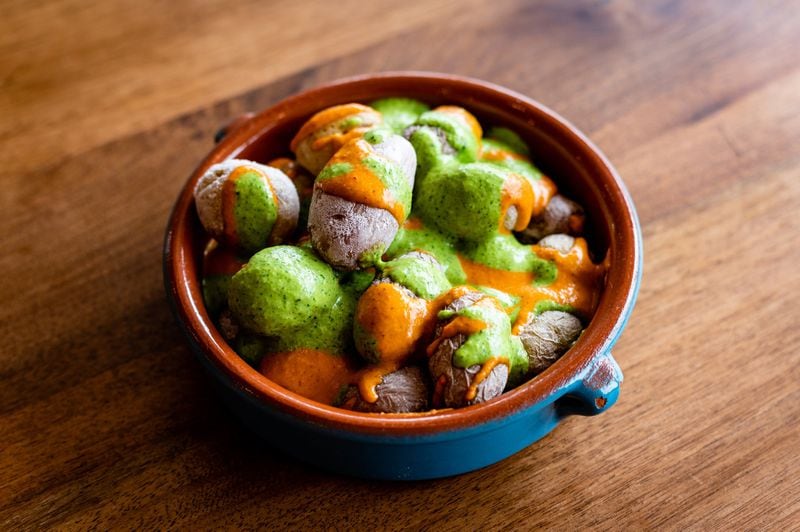 Canary Island Wrinkly Potatoes at Buena Vida are served with two sauces: orange-tinged mojo picón and an herbaceous mojo verde. CONTRIBUTED BY HENRI HOLLIS