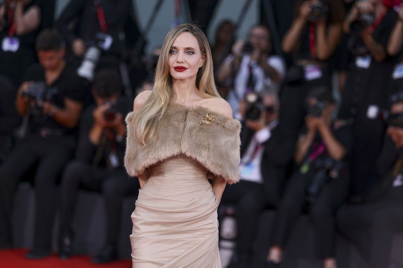 Angelina Jolie poses for photographers upon arrival for the premiere of the film 'Maria' during the 81st edition of the Venice Film Festival in Venice, Italy, on Thursday, Aug. 29, 2024. (Photo by Vianney Le Caer/Invision/AP)