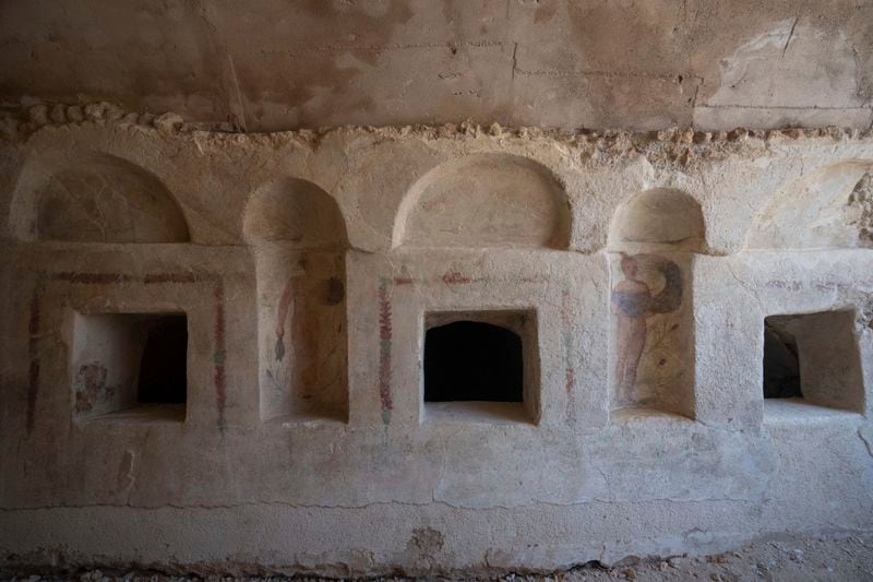 A view of the archeological tomb site in Ashkelon, Israel, Tuesday, Aug. 27, 2024. The tomb with wall paintings depicting Greek mythological figures is at least 1,700 years old said the Israeli Antiquities Authority, whose workers are restoring the site. (AP Photo/Ohad Zwigenberg)