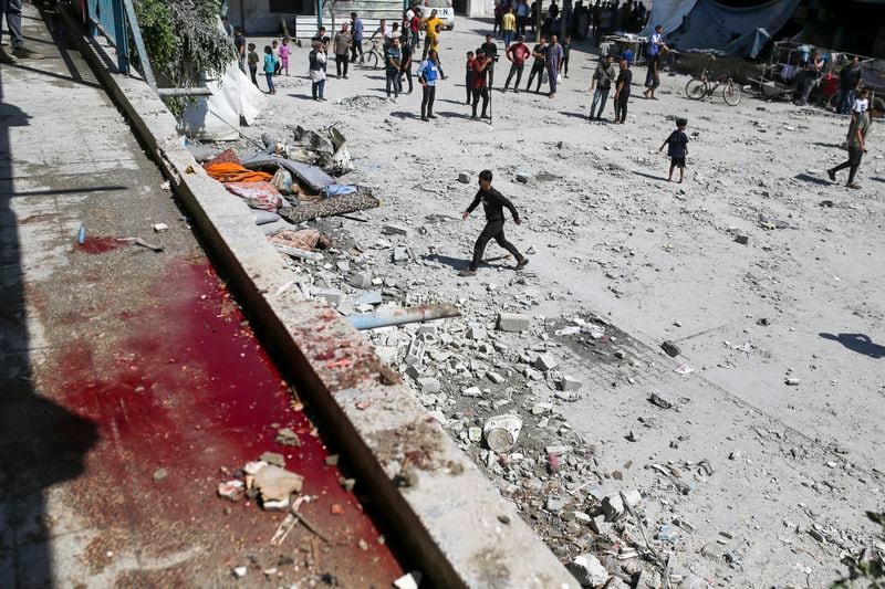 Blood can be seen at the aftermath of the Israeli strike on a U.N.-run school that killed dozens of Palestinians in the Nusseirat refugee camp in the Gaza Strip, Thursday, June 6, 2024. (AP Photo/Jehad Alshrafi)