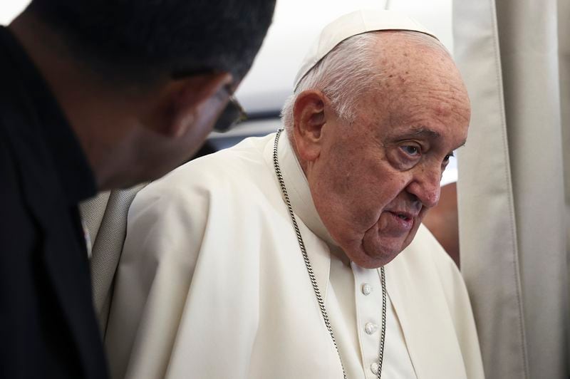 Pope Francis is aboard his flight bound for Luxembourg, where he will start a four-day apostolic journey in Luxembourg and Belgium, Thursday, Sept. 26, 2024. (Guglielmo Mangiapane/Pool Photo via AP)