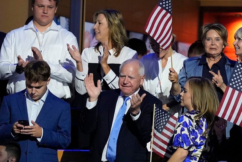 Democratic vice presidential nominee Minnesota Gov. Tim Walz claps during the Democratic National Convention Thursday, Aug. 22, 2024, in Chicago. (AP Photo/Charles Rex Arbogast)