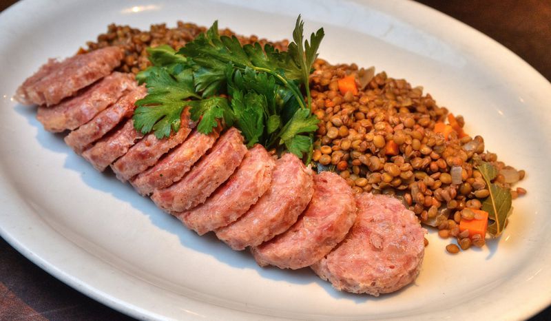 Cotechino con Lenticchie (pork sausage with lentils). STYLING BY CHEF LINDA HARRELL. CONTRIBUTED BY CHRIS HUNT