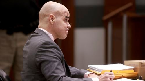 Robert Telles takes notes while listening to testimony during his murder trial at the Regional Justice Center in Las Vegas, Friday, Aug. 16, 2024. (K.M. Cannon/Las Vegas Review-Journal via AP, Pool)