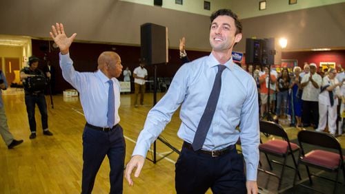 Democratic Senate candidate Jon Ossoff and Rep. John Lewis wave to the crowd at the start of a voter registration rally at the MLK Recreation Center on Saturday, September 28, 2019. STEVE SCHAEFER / SPECIAL TO THE AJC