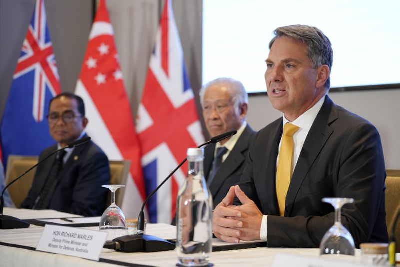 Australian Deputy Prime Minister and Defence Minister Richard Marles, right, speaks during a press conference as Malaysian Defence Minister Mohamed Khaled Nordin, left, Singapore's Defense minister Ng Eng Hen, second from left, listen, on the sidelines of the Shangri-la Dialogue for the Five Power Defence Arrangements (FPDA) Defence Ministers' Meeting [FDMM] in Singapore, in Singapore, Friday, May 31, 2024. (AP Photo/Vincent Thian)