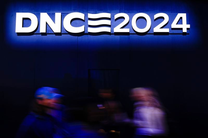 Delegates arrive at the Democratic National Convention Tuesday, Aug. 20, 2024, in Chicago. (AP Photo/Paul Sancya)