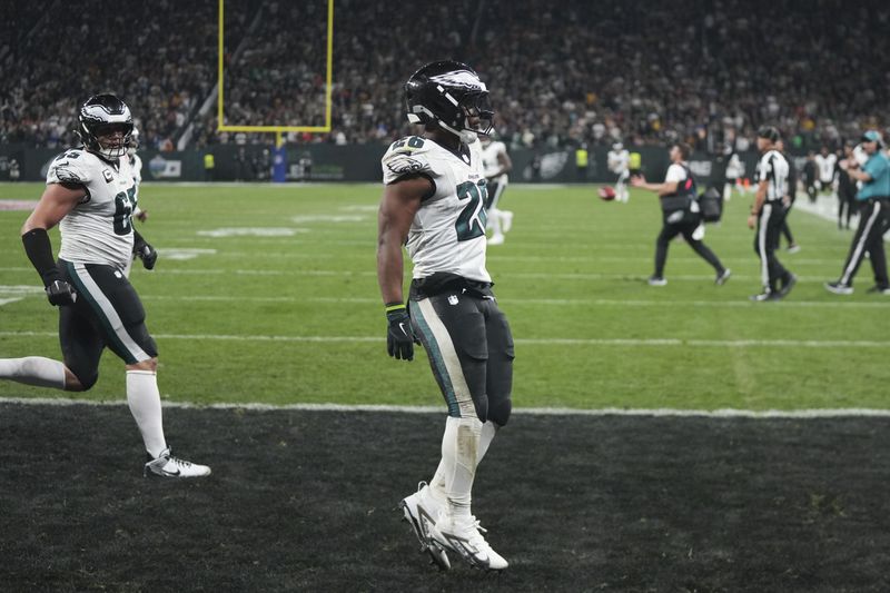 Philadelphia Eagles running back Saquon Barkley (26) celebrates after scoring against the Green Bay Packers during the first half of an NFL football game, Friday, Sept. 6, 2024, at the Neo Quimica Arena in Sao Paulo. (AP Photo/Fernando Llano)