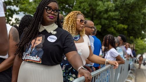 Tiffanie Morris (left) waits outside Georgia State University Convocation Center in Atlanta on Tuesday before a Kamala Harris campaign rally. Democrats and Republicans are both trying to woo younger voters. (Arvin Temkar / AJC)