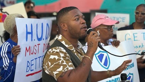 Community organizer Devin Barrington-Ward speaks at a demonstration urging U.S. Department of Housing and Urban Development oversight of apartment complexes on Wednesday, Sept. 4. 2024 (Matt Reynolds/AJC)