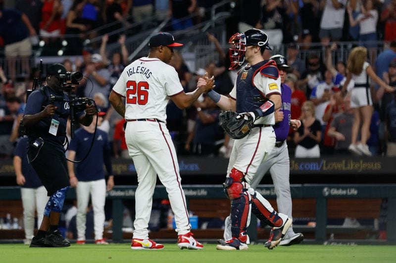 Atlanta Braves pitcher Raisel Iglesias (26) shake hands with Atlanta Braves catcher Sean Murphy (12) after defeating the Col;orado Rockies 3-0  at Truist Park on Tuesday, Sept. 3, 2024, in Atlanta. 

(Miguel Martinez/ AJC)