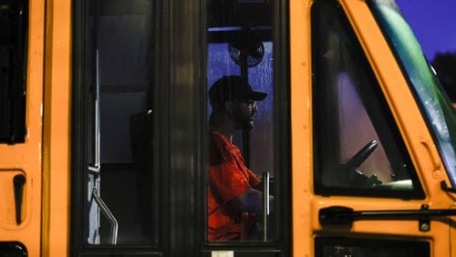 An Atlanta Public Schools bus driver exits the Lakewood Bus Depot to pick up students on the first day of school on Thursday, Aug. 1, 2024. APS is one of the only districts in the area that had a full staff of bus drivers on the first day of school. (Natrice Miller/ AJC)