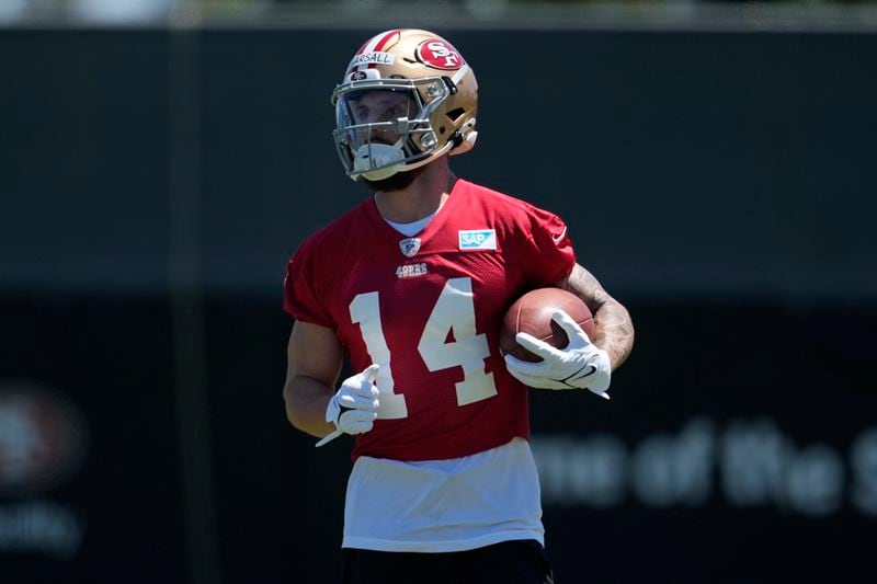 FILE - San Francisco 49ers wide receiver Ricky Pearsall carries the ball during the NFL football team's rookie minicamp in Santa Clara, Calif., May 10, 2024. (AP Photo/Jeff Chiu, File)