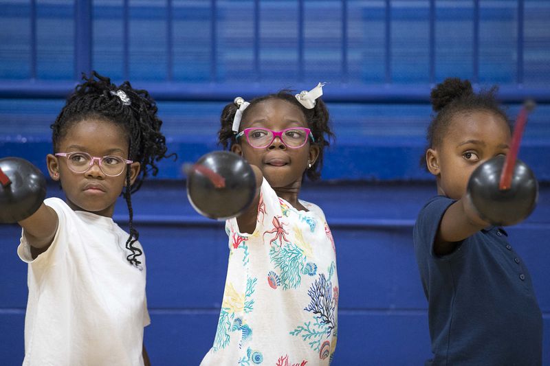Harper-Archer Elementary school students learn the different stances in fencing while practicing the sport during an after school program in the school's gym, Wednesday, October 2, 2019.  (ALYSSA POINTER/ALYSSA.POINTER@AJC.COM)