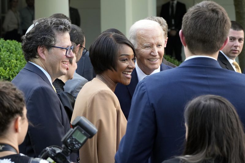 President Joe Biden poses for a photo with actor Tiffany Haddish at a Jewish American Heritage Month event at the White House on Monday. 