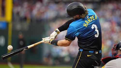 Philadelphia Phillies' Bryce Harper hits a double against Atlanta Braves pitcher Reynaldo López during the first inning of a baseball game, Friday, Aug. 30, 2024, in Philadelphia. (AP Photo/Matt Slocum)