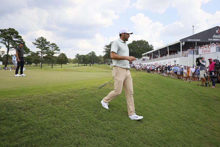 Scottie Scheffler walks out of the fifth green during the final round of the Tour Championship at East Lake Golf Club, Sunday, Sept. 1, 2024, in Atlanta.
(Miguel Martinez / AJC)