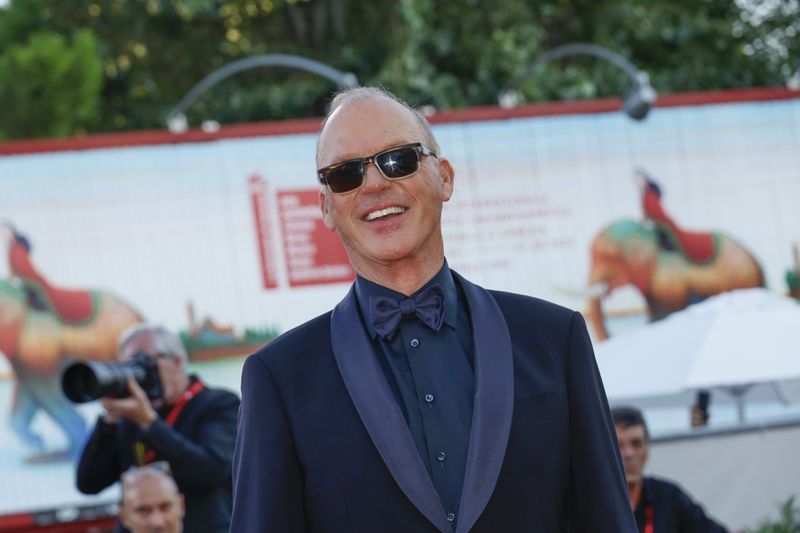 Michael Keaton poses for photographers upon arrival for the premiere of the film 'Beetlejuice Beetlejuice' and the opening ceremony of the 81st edition of the Venice Film Festival in Venice, Italy, on Wednesday, Aug. 28, 2024. (Photo by Joel C Ryan/Invision/AP)