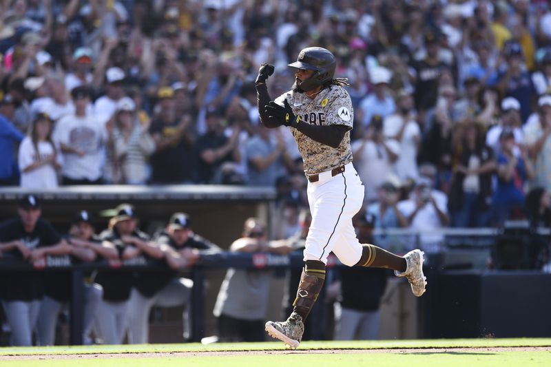 San Diego Padres' Fernando Tatis Jr. celebrates while heading to home plate after hitting a solo home run against the Chicago White Sox in the eighth inning of a baseball game, Sunday, Sept. 22, 2024, in San Diego. (AP Photo/Derrick Tuskan)