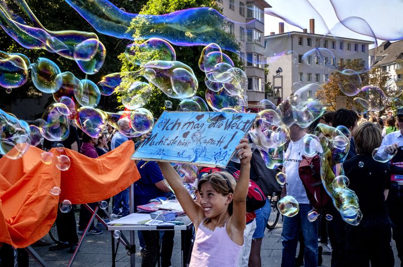 A girl takes part in a Fridays for Future protest in Frankfurt, Germany, Friday, Sept. 20, 2024. (AP Photo/Michael Probst)