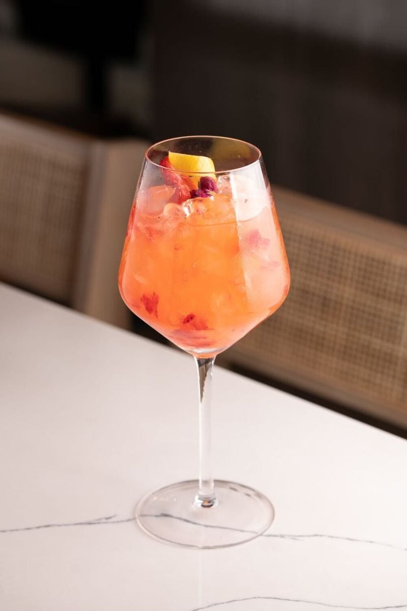 The Selena cocktail at El Gordo in the Uptown Atlanta development is made with rose wine, rose cordial, Diega strawberry rose gin, strawberry, lemon and orange.. / Courtesy of El Gordo