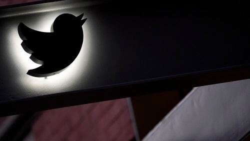 FILE - The Twitter logo is seen on the awning of the building that houses the Twitter office in New York, on Oct. 26, 2022. The European Union says blue checkmarks from Elon Musk’s X are deceptive and that the online platform falls short on transparency and accountability requirements. (AP Photo/Mary Altaffer, File)