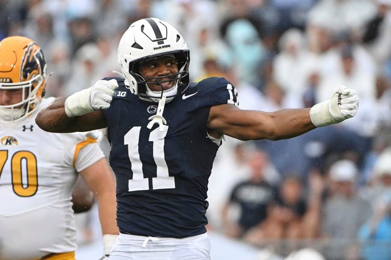 Penn State defensive end Abdul Carter (11) celebrates after a tackle against Kent State during the first quarter of an NCAA college football game, Saturday, Sept. 21, 2024, in State College, Pa. (AP Photo/Barry Reeger)