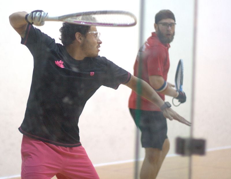 Racquetball singles format occurs in sets called rallies in which participants volley a ball against a front wall. Here, Daniel De La Rosa, left, and Jake Bredenbeck engage in a rally.