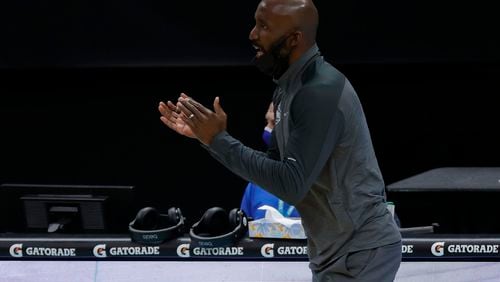 Coach Lloyd Pierce of the Atanta Hawks reacts following a call during the first quarter of their game against the Charlotte Hornets at Spectrum Center on Jan. 9, 2021 in Charlotte, North Carolina. (Jared C. Tilton/Getty Images/TNS)