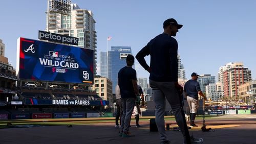 Atlanta Braves players Luke Williams, left, and Eli White, center, wait to their turn during batting practice before game 1 of the NL Wild Card Series against the San Diego Padres at Petco Park, Tuesday, October 1, 2024, in San Diego, Ca.  (Jason Getz / AJC)

