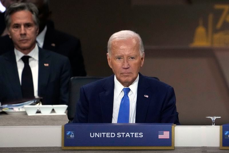 President Joe Biden sits as Secretary of State Antony Blinken, left, looks on during Working Session III of the NATO Summit in Washington, Thursday, July 11, 2024. (AP Photo/Susan Walsh)