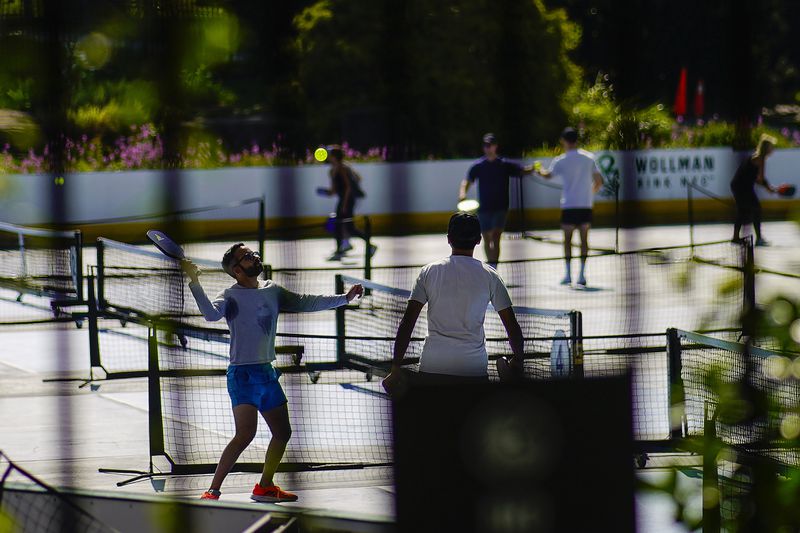 People practice pickleball on the courts of CityPickle at Central Park's Wollman Rink, Saturday, Aug. 24, 2024, in New York. (AP Photo/Eduardo Munoz Alvarez)