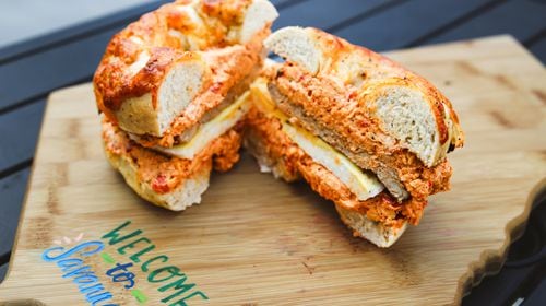 At Big Bon Bodega, you can get savory pork sausage and fluffy egg patties nestled in a cheddar cheese bagel smeared with cheddar-pimento cream cheese. (Adriana Iris Boatwright for The Atlanta Journal-Constitution)