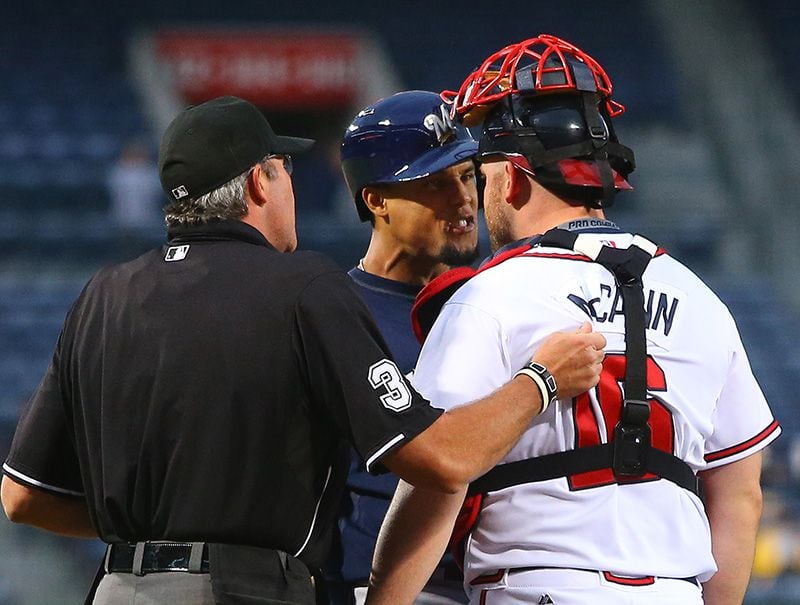 ADVANCE FOR WEEKEND EDITIONS AUG. 27-28 ** Atlanta Braves rookie catcher Brian  McCann throws out during a game against the Washington Wednesday, July 27,  2005 in Atlanta. McCann and fellow rookies