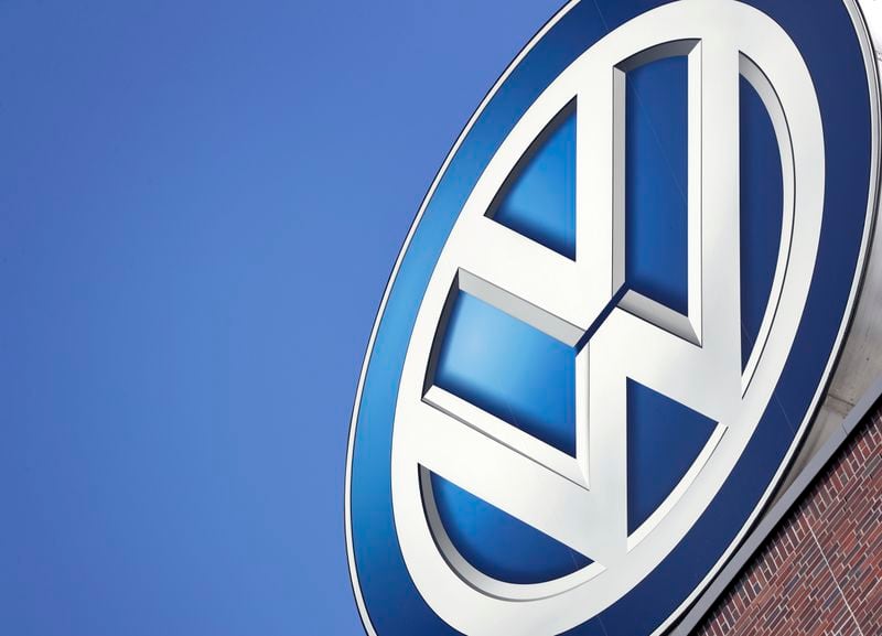 FILE - In this Wednesday, Aug. 1, 2018, file photo a logo of the car manufacturer Volkswagen is pictured on top of a company building in Wolfsburg, Germany. (AP Photo/Michael Sohn, file)