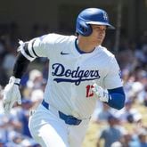 Los Angeles Dodgers designated hitter Shohei Ohtani (17) runs to first on a double during the fourth inning of a baseball game against the San Francisco Giantscin Los Angeles, Calif., Thursday, July 25, 2024. (AP Photo/Eric Thayer)