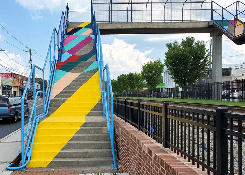 The Stansells brought brilliant color to the pedestrian bridge over North Central Avenue in Hapeville.