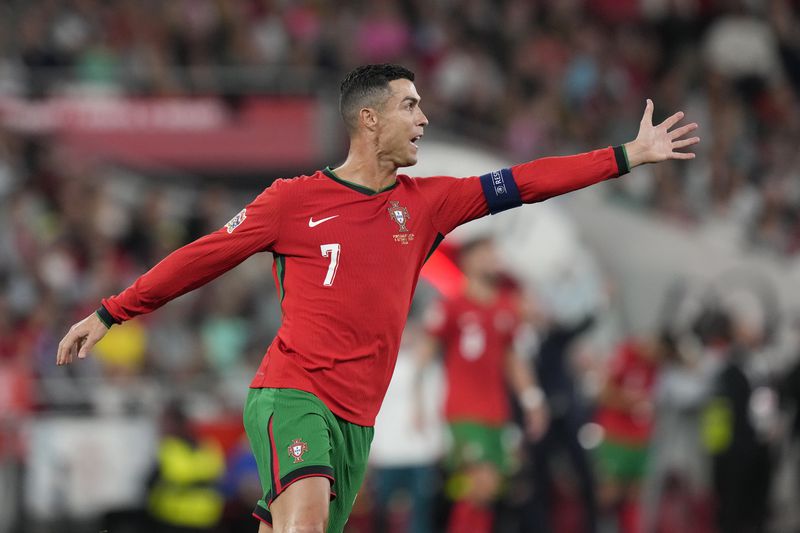 Portugal's Cristiano Ronaldo gestures during the UEFA Nations League soccer match between Portugal and Scotland at the Luz stadium in Lisbon, Portugal, Sunday, Sept. 8, 2024. (AP Photo/Armando Franca)