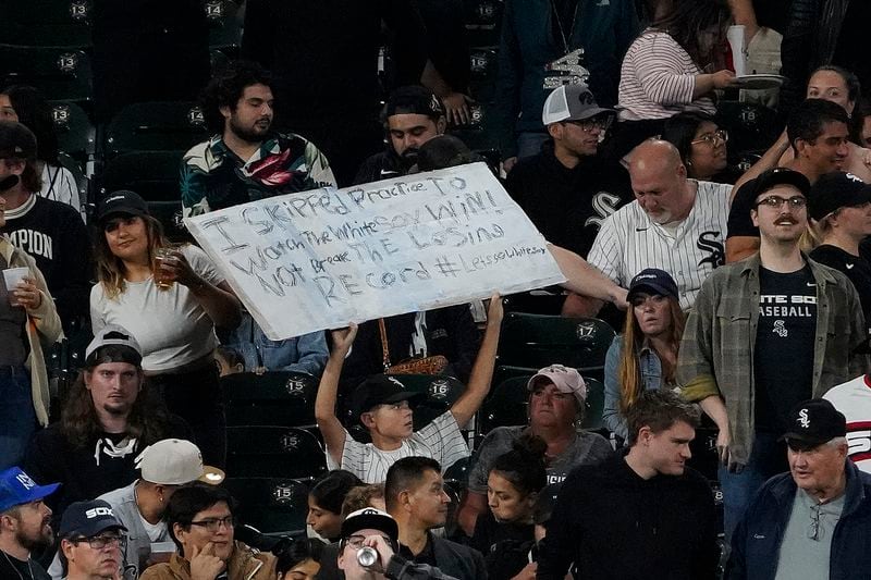 A fan hold a sign during the seventh inning of a baseball game between the Chicago White Sox and the Los Angeles Angels, Wednesday, Sept. 25, 2024, in Chicago. (AP Photo/David Banks)