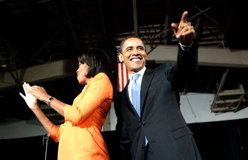 Democratic presidential hopeful, Sen. Barack Obama, D-Ill., and his wife Michelle acknowledge supporters at a primary election night rally in Raleigh, N.C.