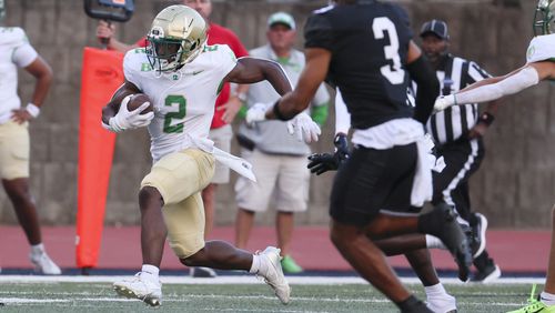 Buford running back Justin Baker (2) returns the opening kick to start their game against Milton at Milton High School, Friday, August 16, 2024, in Milton, Ga. (Jason Getz / AJC)
