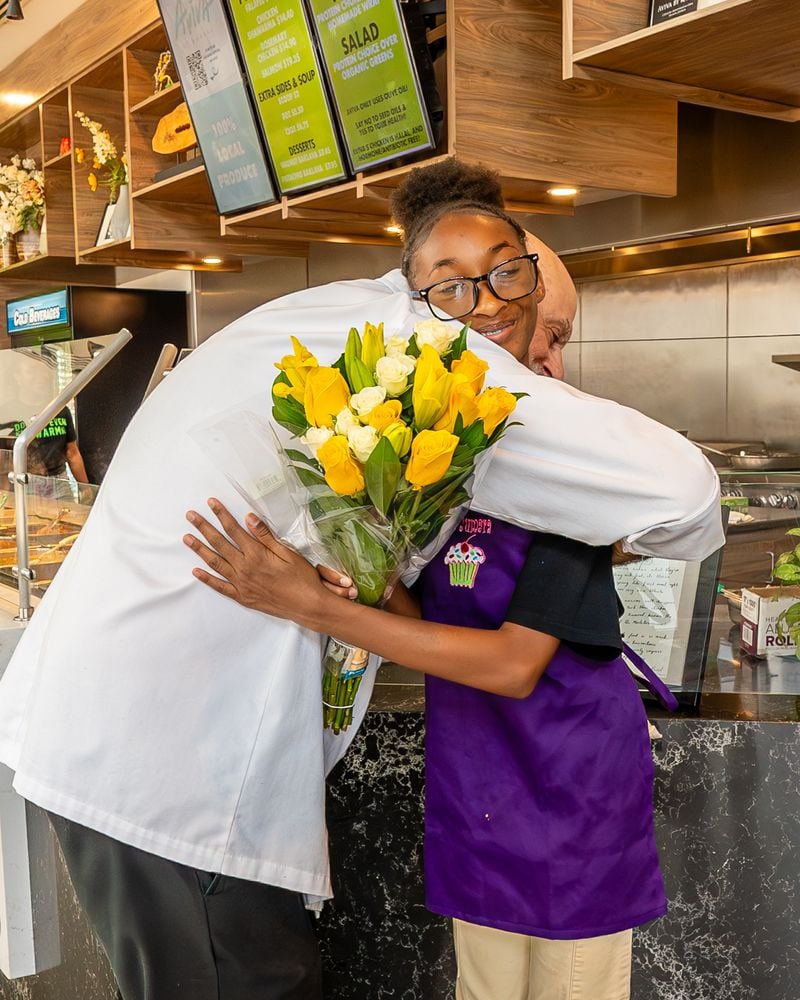 Chef Kameel Srouji and chef Yumara Nash cook salmon and pasta together in the Aviva by Kameel kitchen. Nash, 12, has built a following on social media for her cooking videos. Courtesy of J. Alburi/the Imprints